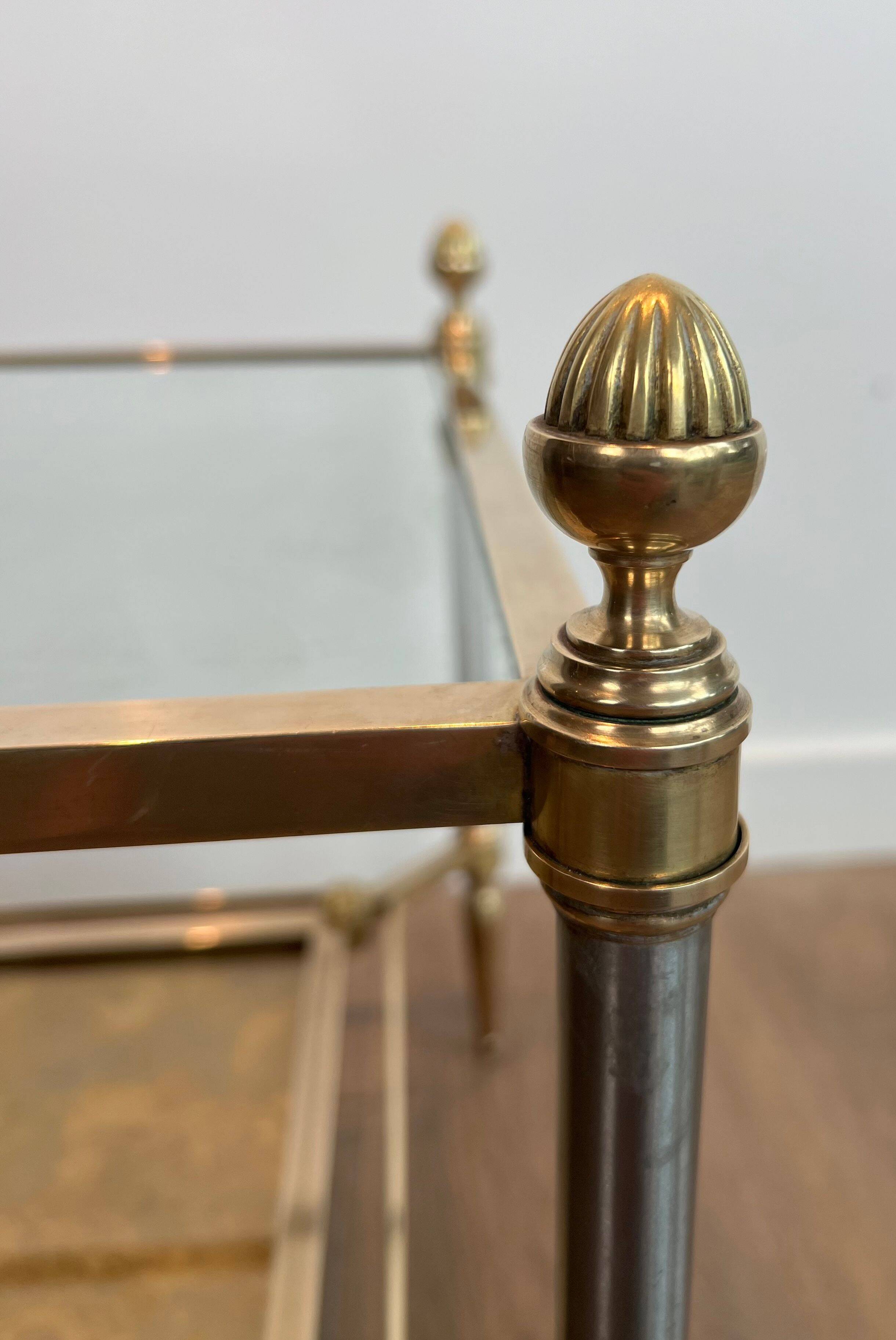 Pair of neoclassical side tables in steel and brass by Maison Jansen.