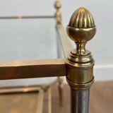 Pair of neoclassical side tables in steel and brass by Maison Jansen.