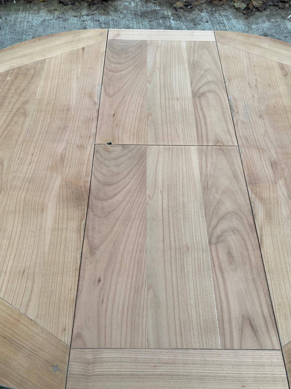 Round extendable dining table with a central pedestal base, renovated in raw wood, 150cm