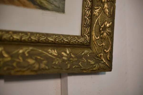 Lithograph of a woodland path, gilt frame, with embossed foliage decoration, 1950s
