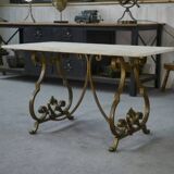 Side table with a gilt wrought iron base attributed to Gilbert Poillerat, with a travertine top, 1940s