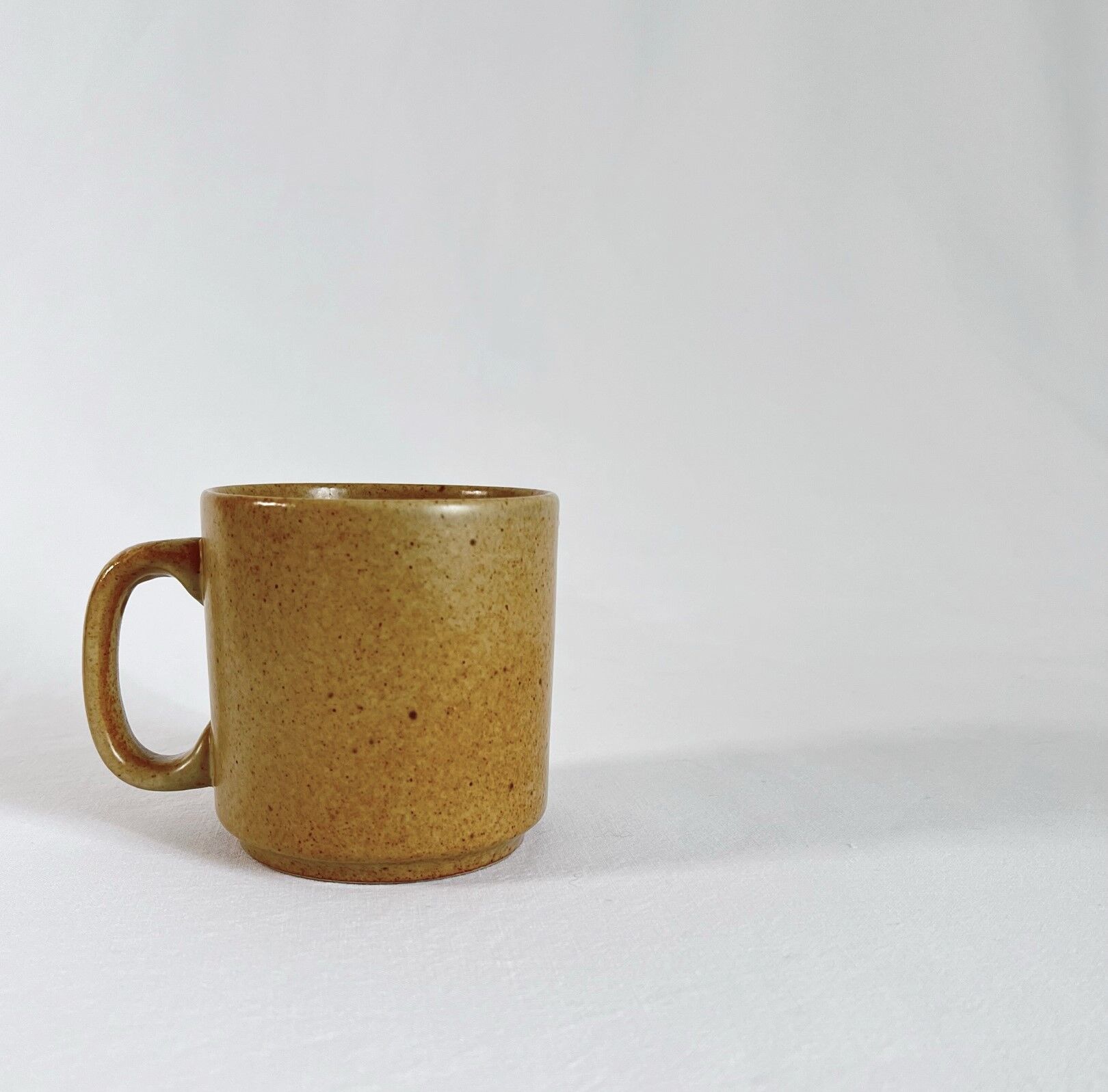 Vintage mug in speckled beige sandstone