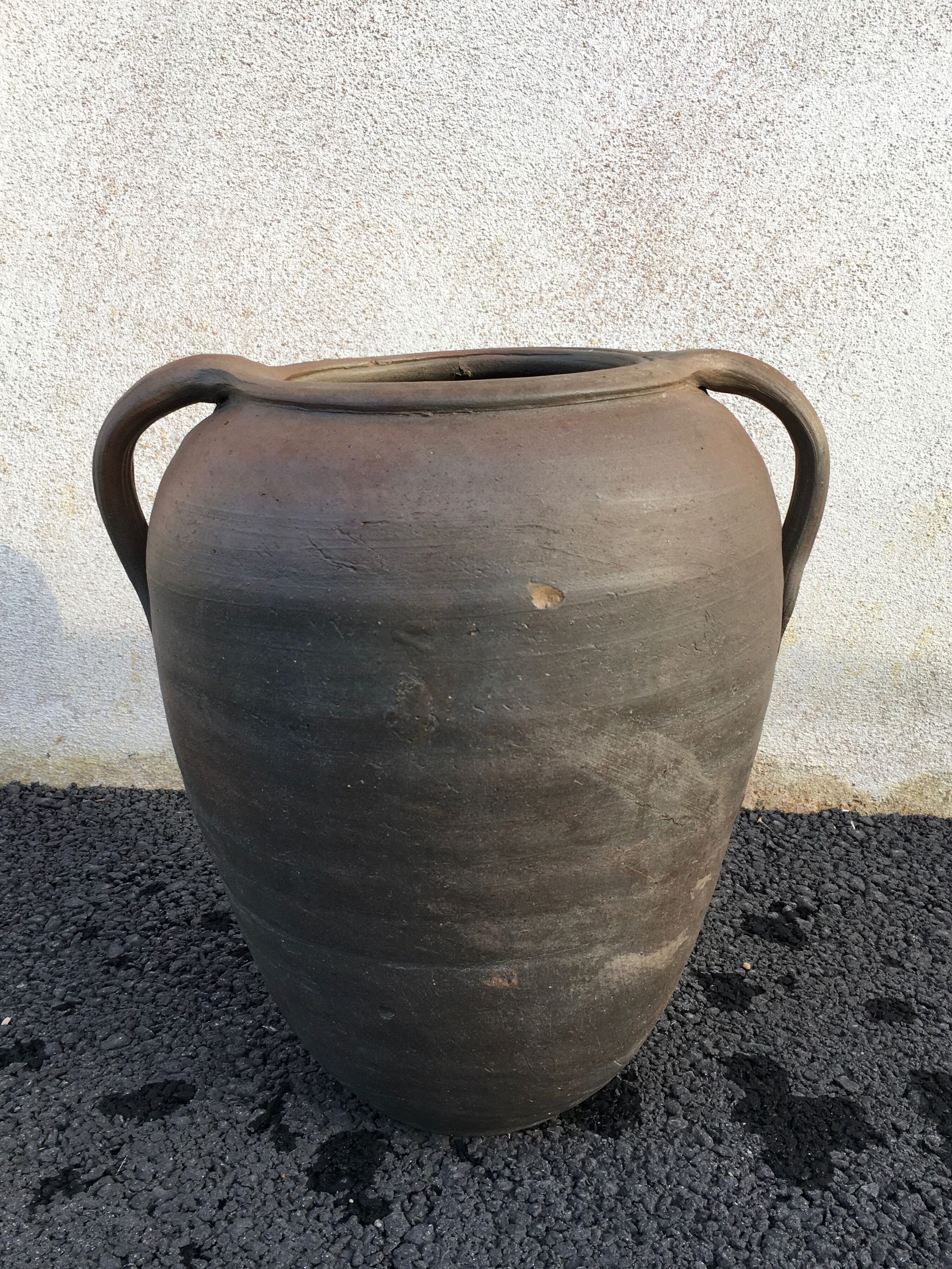 Old jug with two sandstone handles