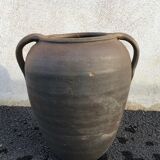 Old jug with two sandstone handles