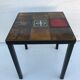 Old black metal and majolica tiles table