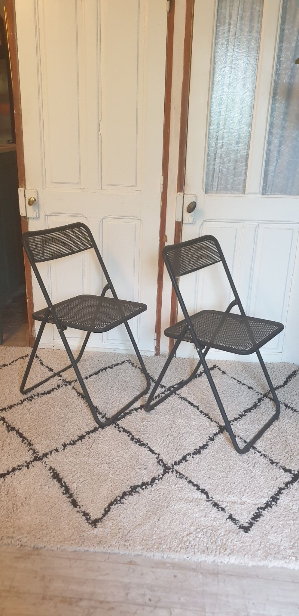 Pair of folding chairs in perforated metal