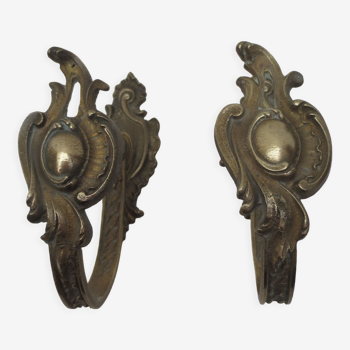 Pair of embraces in brass or bronze