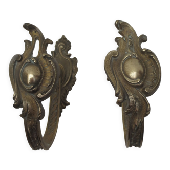 Pair of embraces in brass or bronze