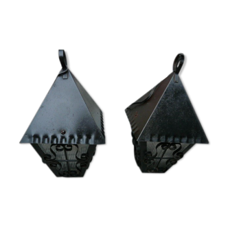 pair of wrought iron lanterns and granite glass