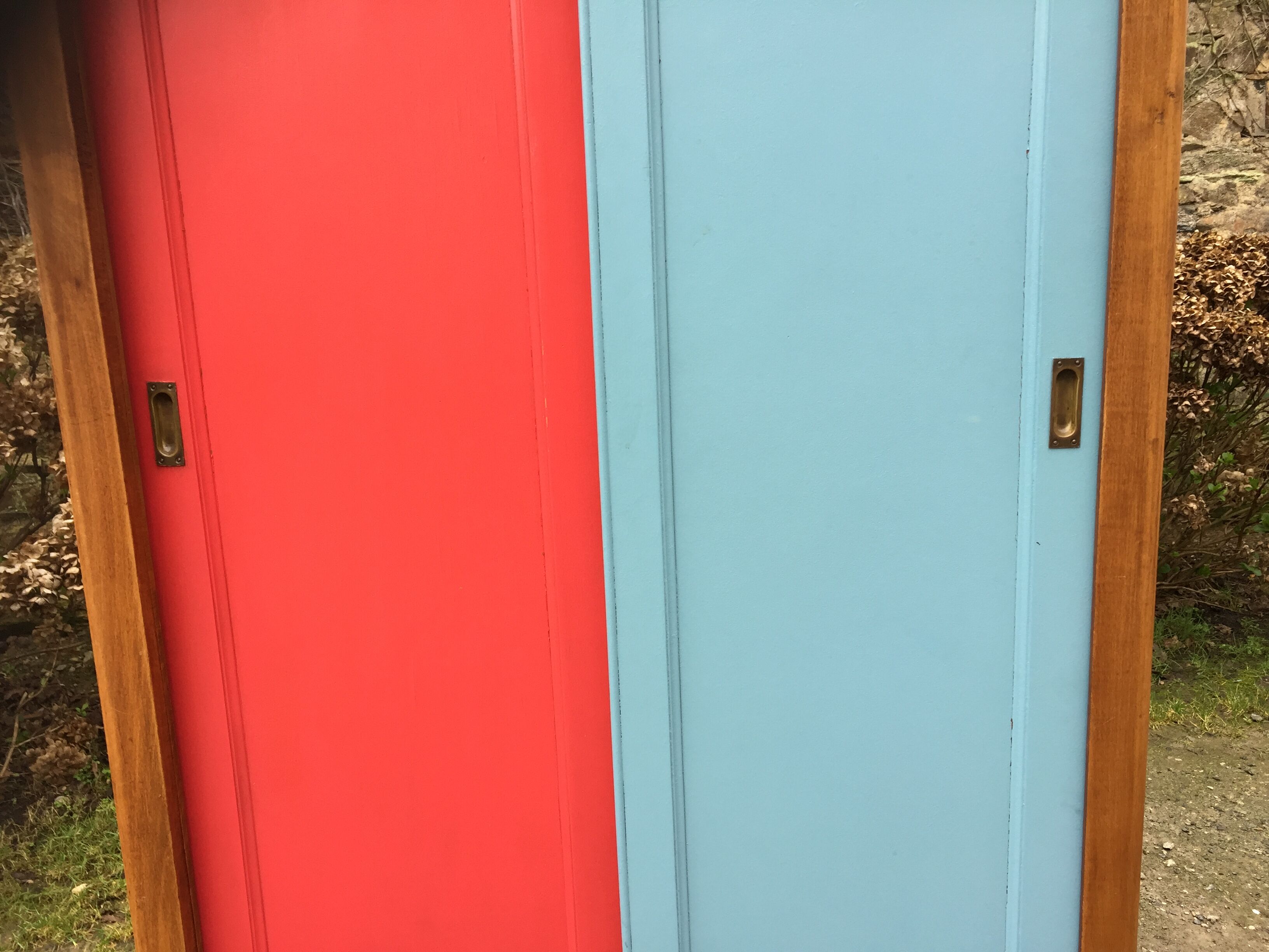 Vintage oak compass foot cabinet with 2 sliding doors painted red and blue