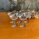 5 old champagne glasses
