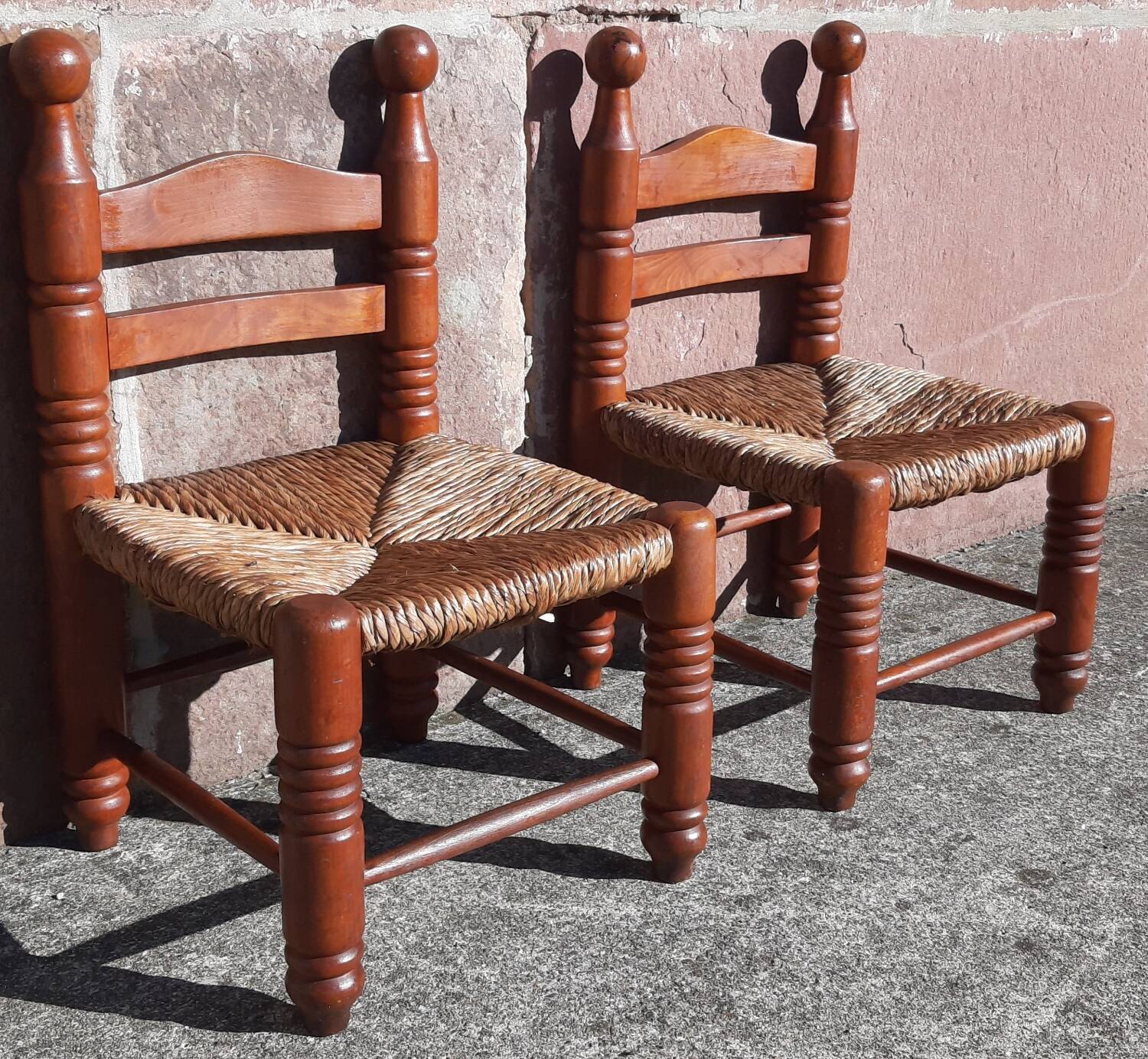 Pair of low armchairs by the fireplace. (Straw seat)