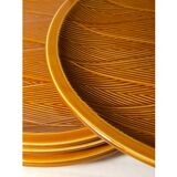 Ten plates in Salins slip with braided patterns 50s