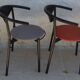 4 gondola-style chairs with a sturdy metal frame and faux leather.