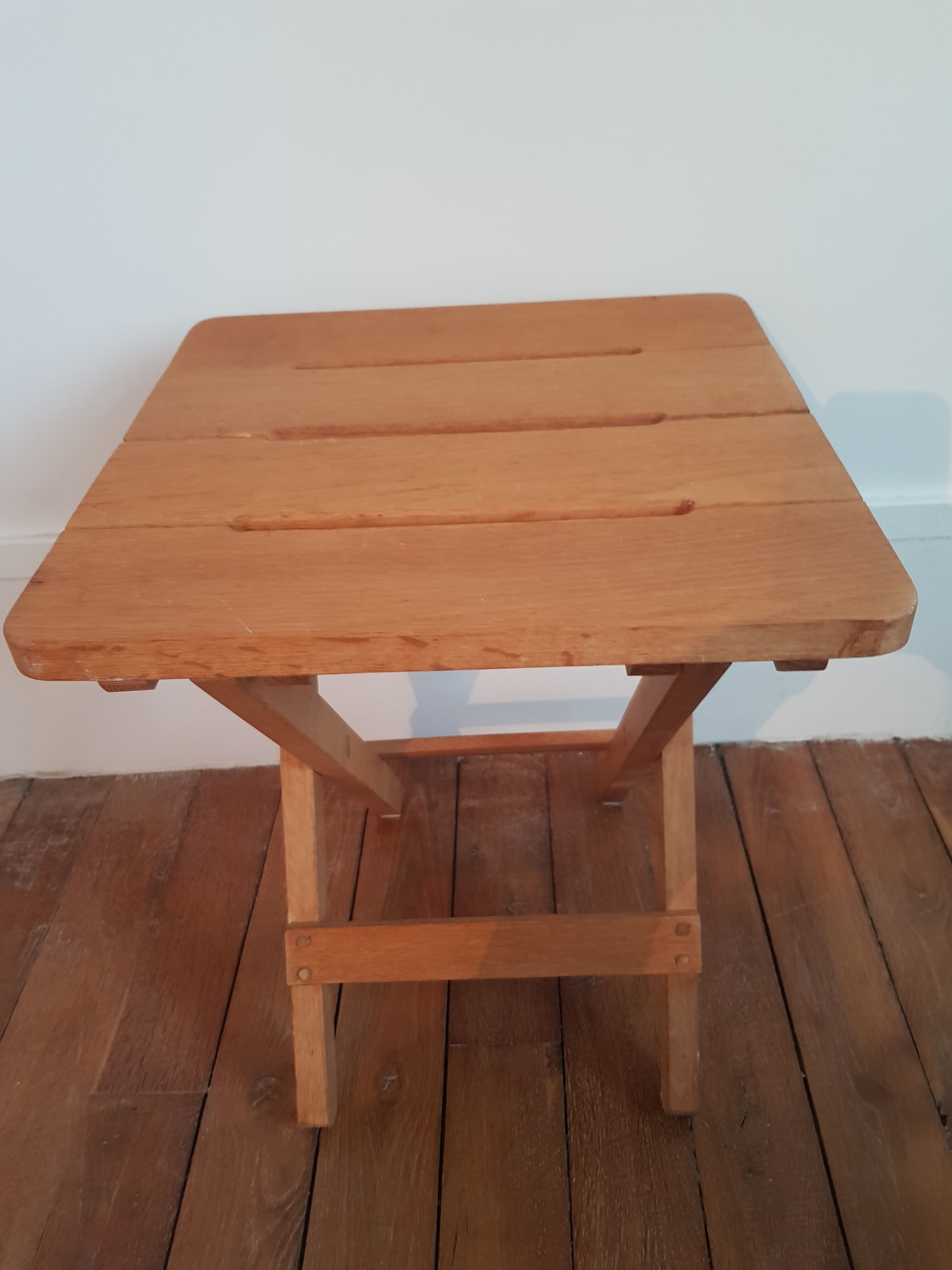 Folding stool made of solid wood