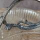 Vintage glass serving tray with silver-plated handle.