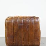 Cognac-colored cowhide 2-seater designer sofa finished with piping