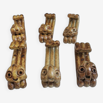 Six zoomorphic sandstone knife holders