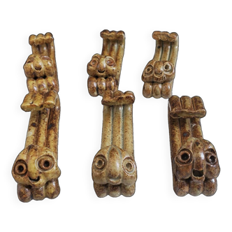 Six zoomorphic sandstone knife holders