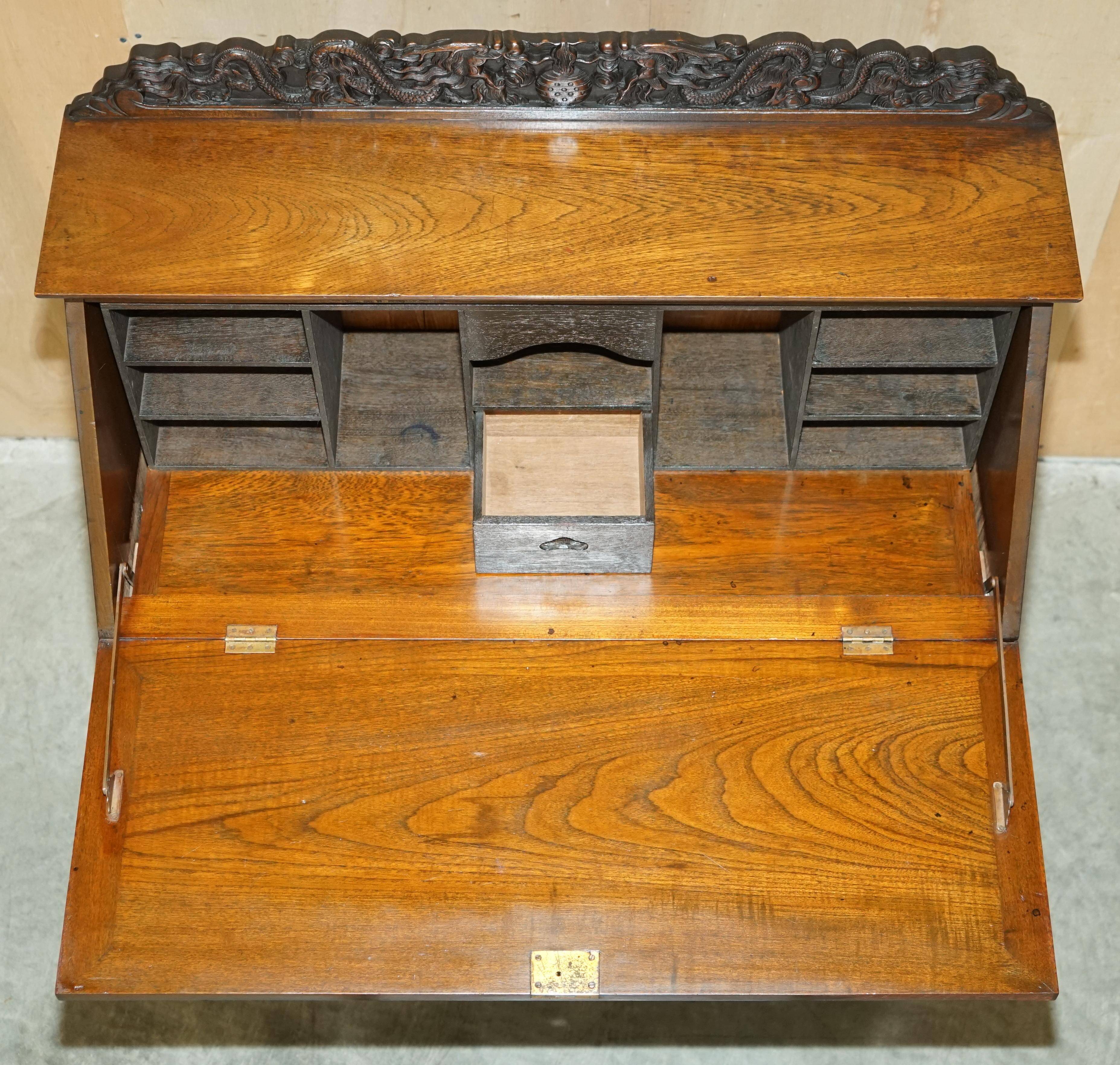 Chinese hand-carved desk from around 1940 with matching chair.