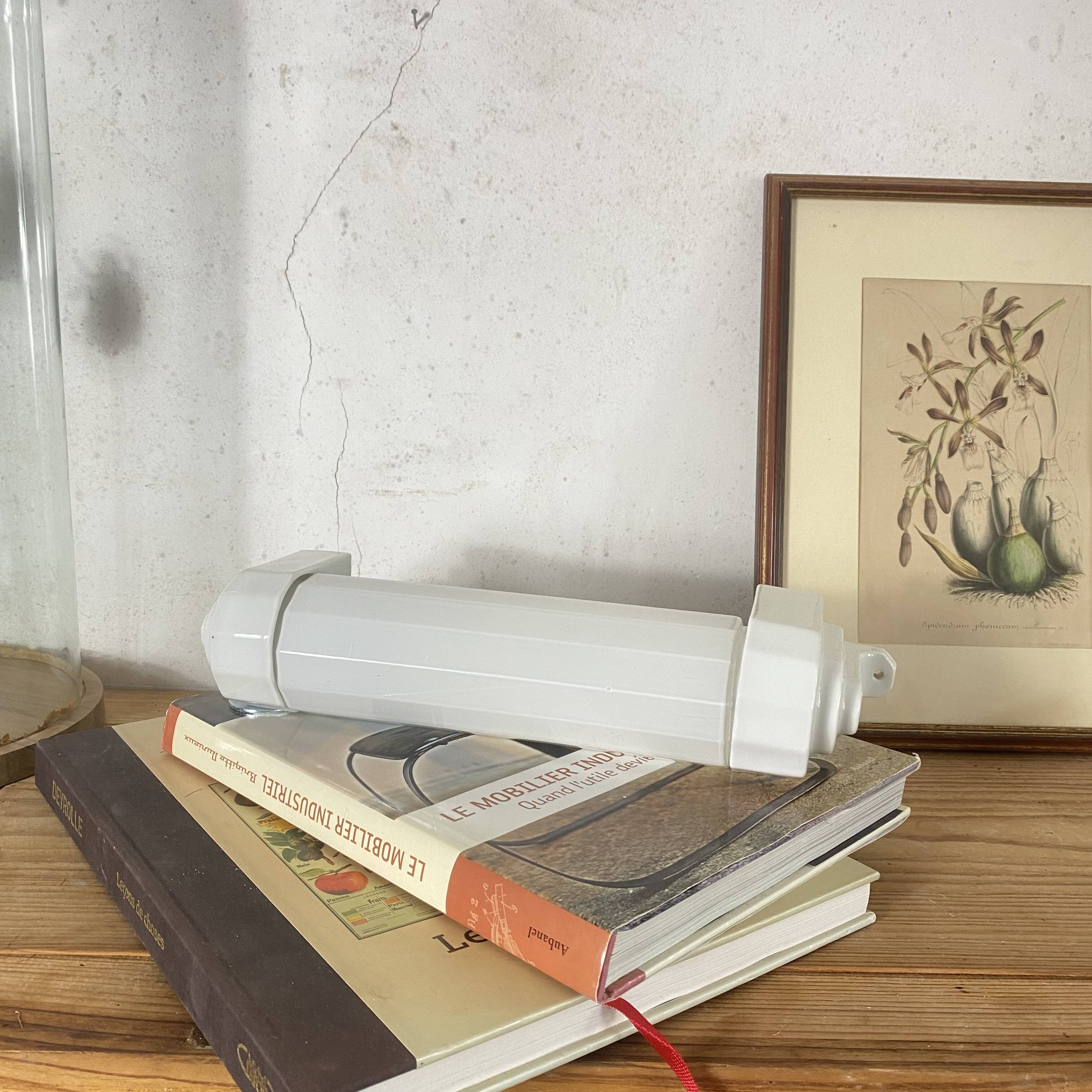 Art Deco tubular wall light in ceramic and white opaline glass tube.