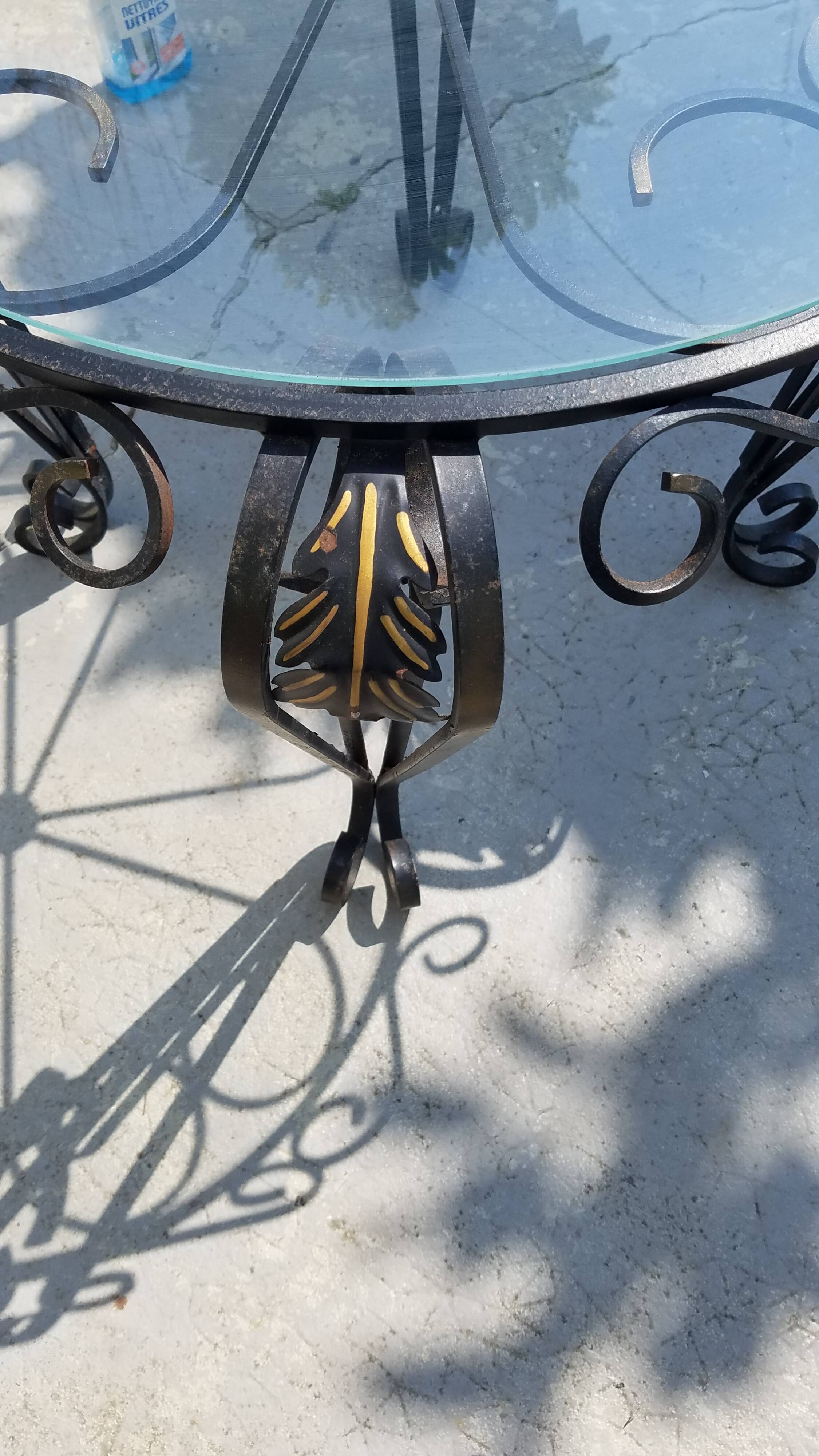 Wrought iron and glass round table