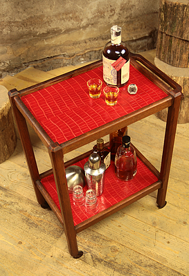 Serving in varnished chestnut and red leather