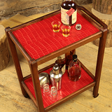 Serving in varnished chestnut and red leather