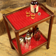 Serving in varnished chestnut and red leather