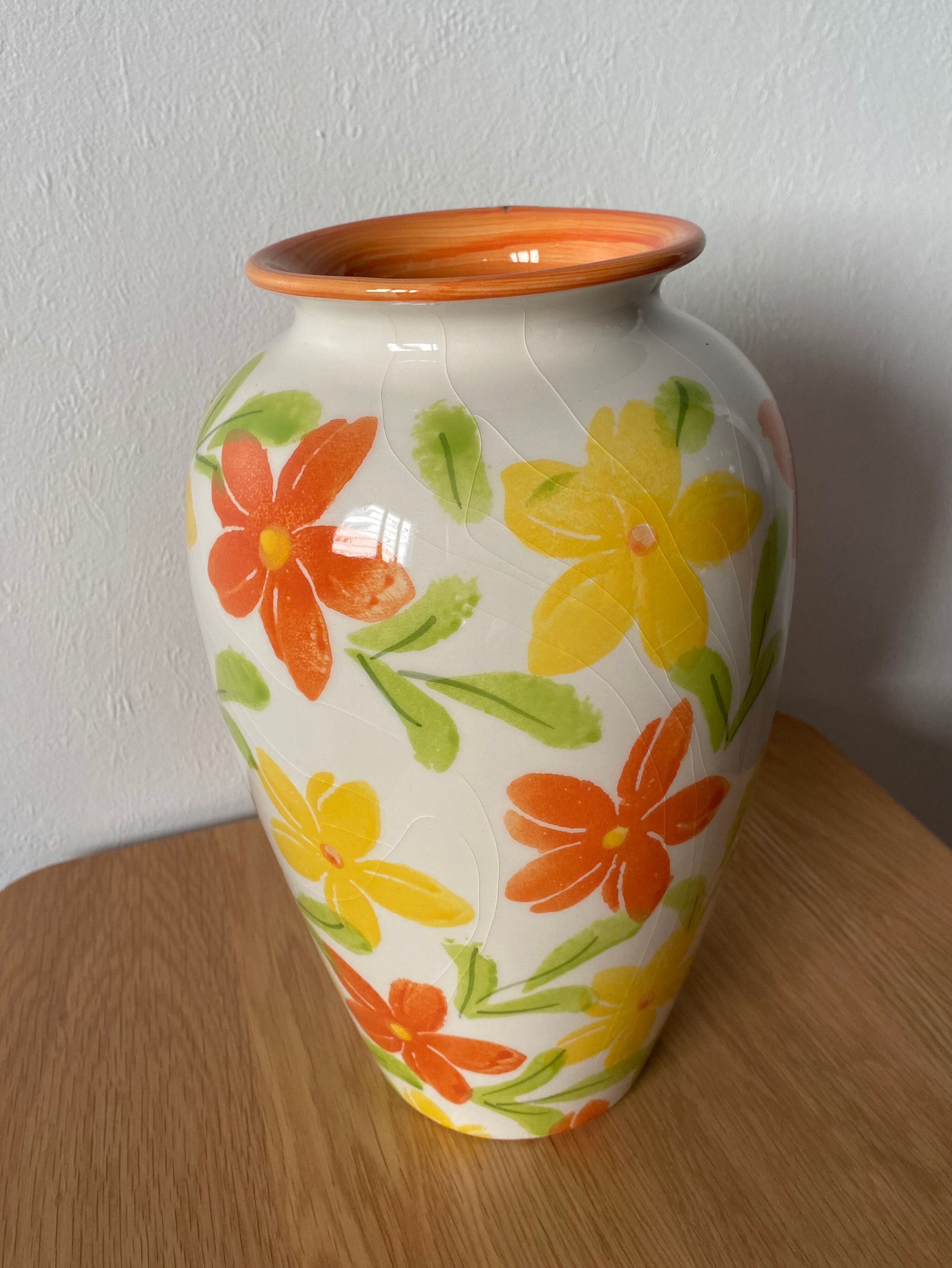 White vase with flowers