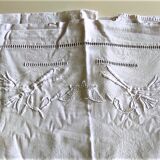 Old drapework and embroidered with 2 flowers and a butterfly