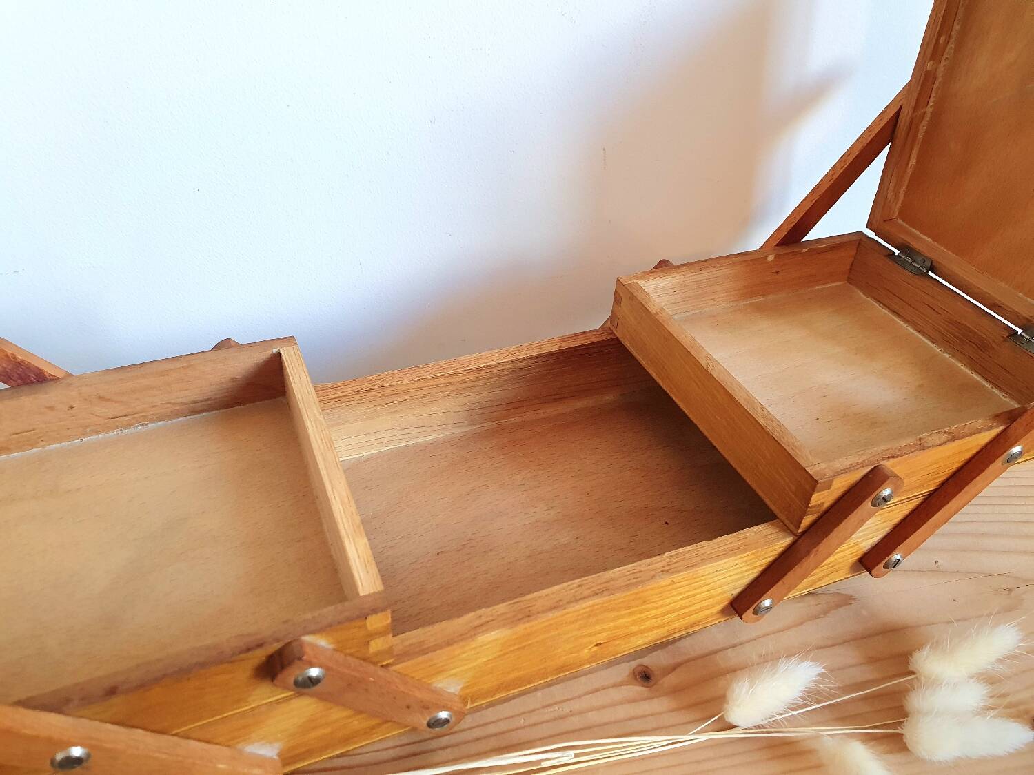 Small wooden sewing worker