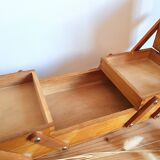 Small wooden sewing worker