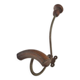 Vintage 1960s wall coat rack in wood and metal.