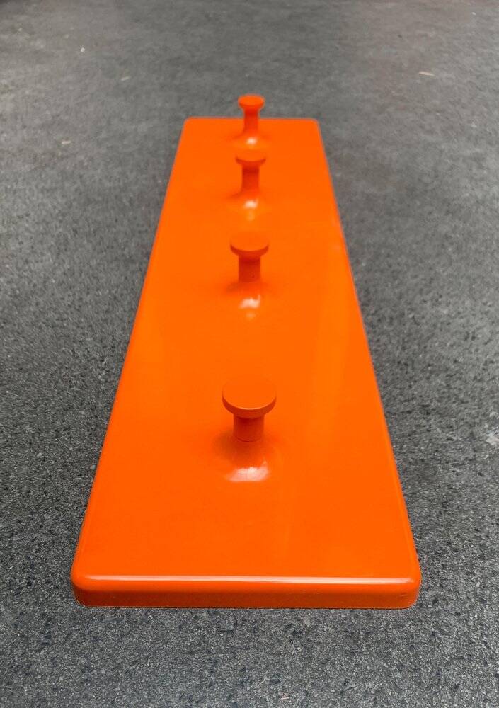 Orange coat rack from the mid-century space age, 1960s.
