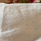 Old white cotton tablecloth.