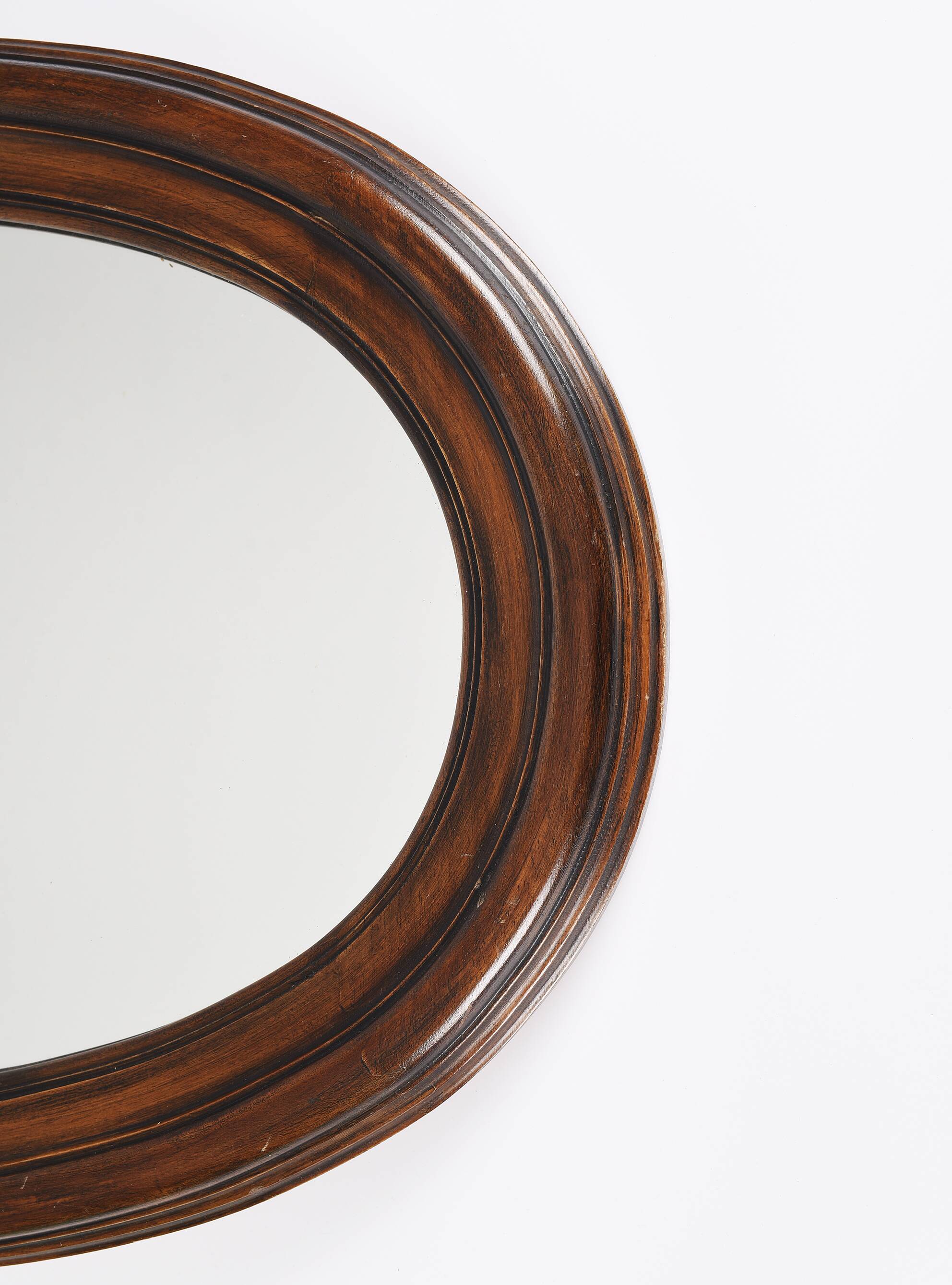 Large old oval wooden mirror