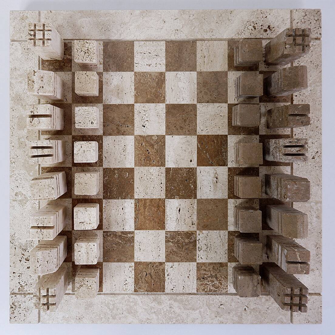 Modernist two-tone travertine chess set, Italy, 1970s