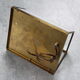 Wall sconce in brass and glass