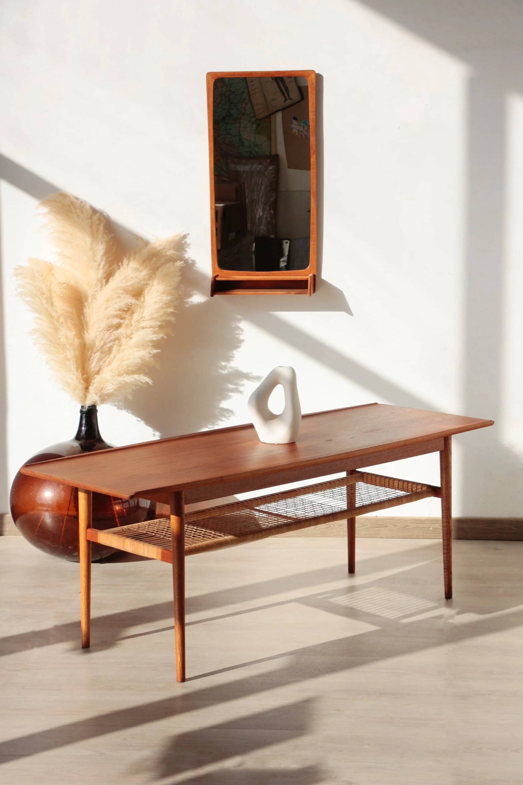 Vintage Scandinavian coffee table in teak and rattan – Danish design from the 1960s.
