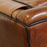 Set of 2 very comfortable large sheepskin armchairs elegantly finished with black piping