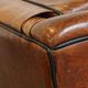 Set of 2 very comfortable large sheepskin armchairs elegantly finished with black piping