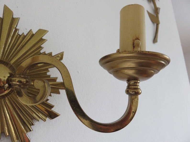 Wall lamp "little sun" in 70s golden brass