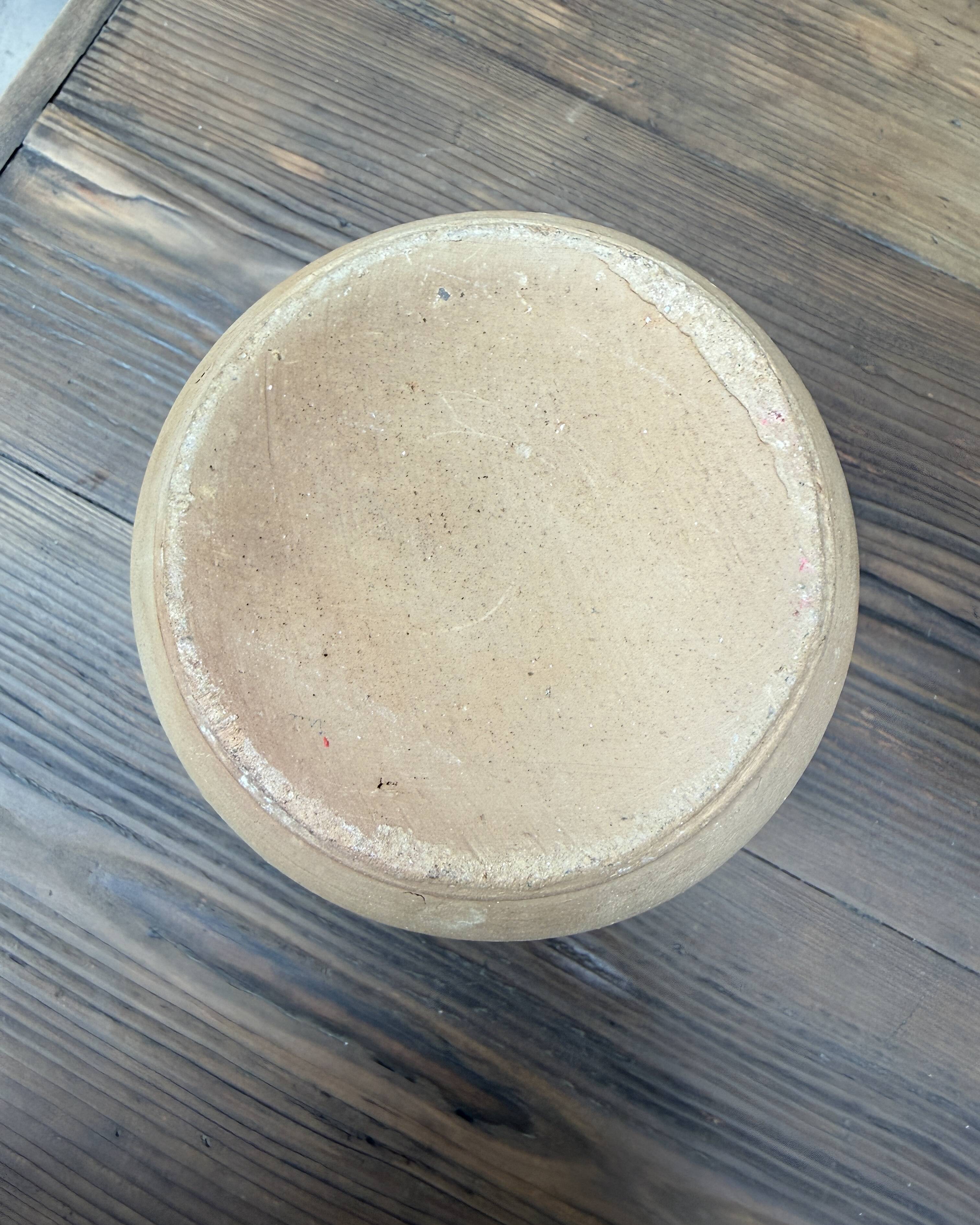 Unfired clay pitcher