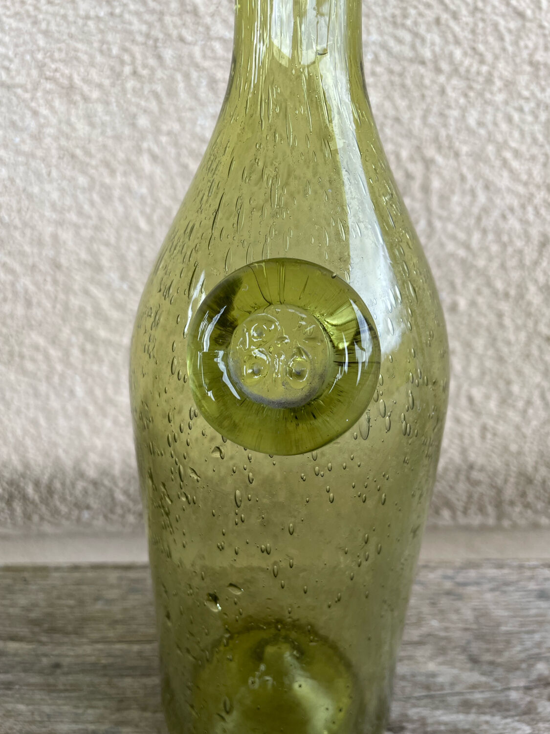 70s biot glass bottle