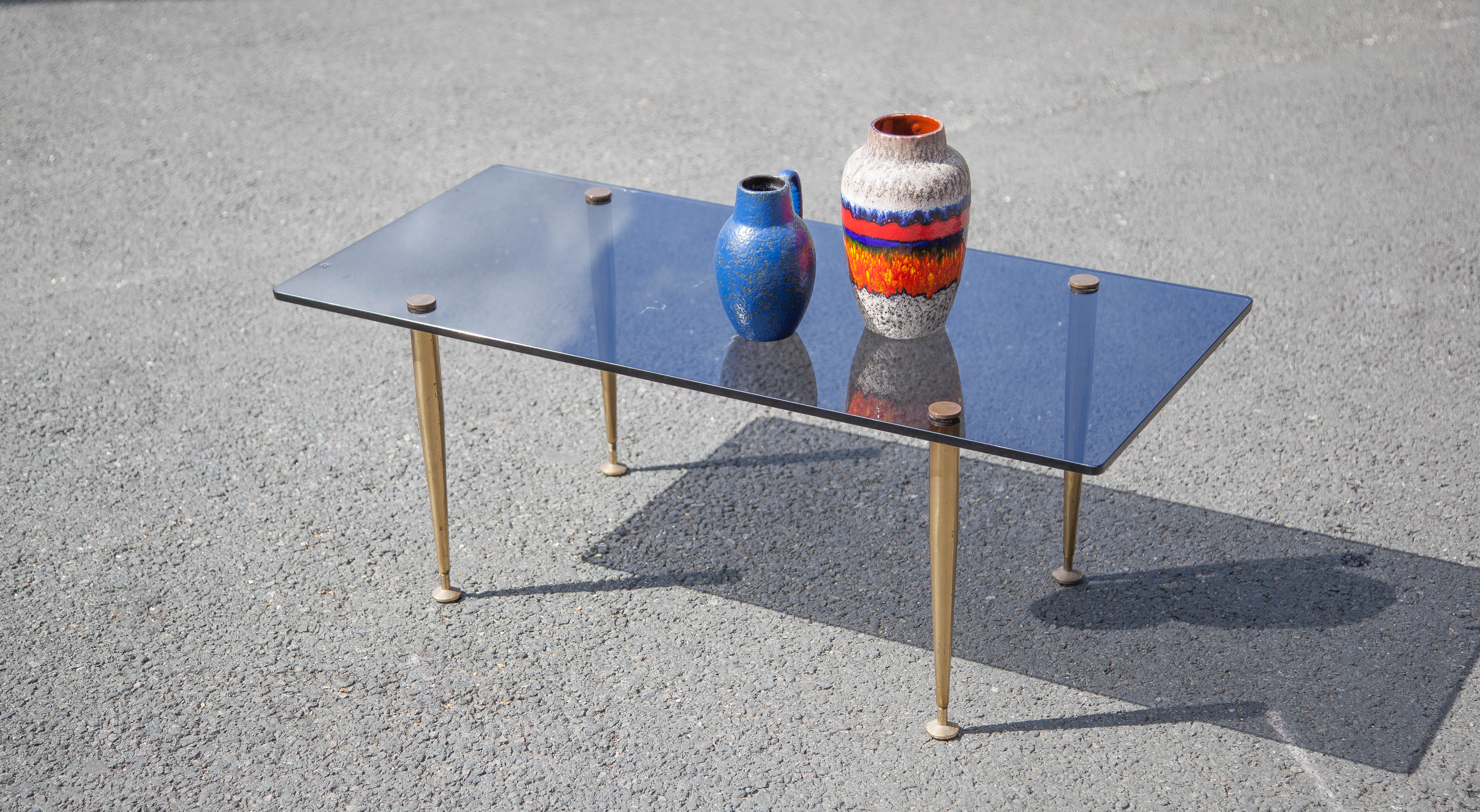 Smoked glass coffee table with adjustable brass legs, end of sofa, 70s table