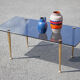 Smoked glass coffee table with adjustable brass legs, end of sofa, 70s table