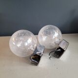 Pair of vintage wall lights in chrome metal with bubbled glass globes.
