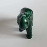Small emerald green ceramic elephant.