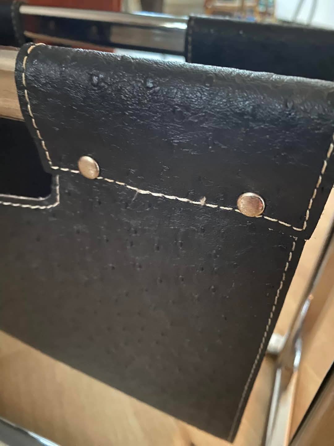 Chrome metal and leather magazine rack